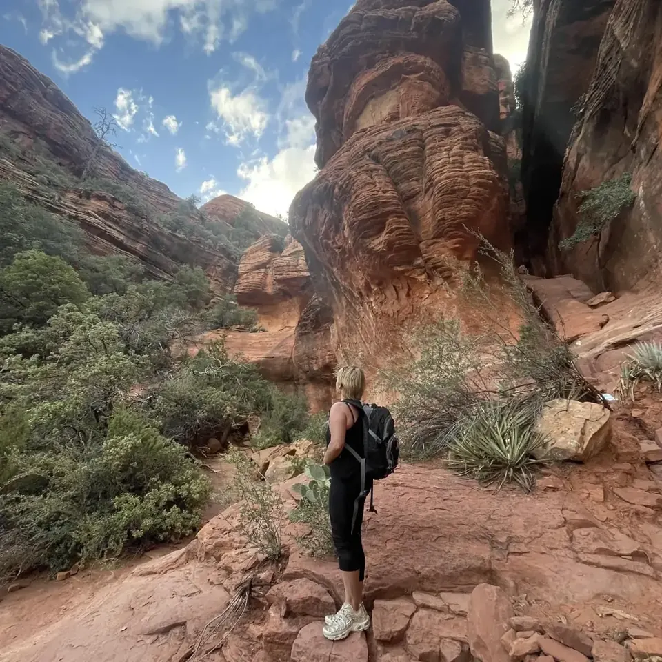 Hiker on red rock in Sedona