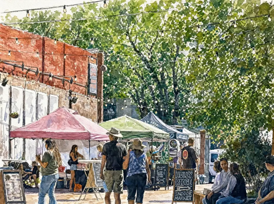 Market tents and shoppers under string lights on a Prescott street