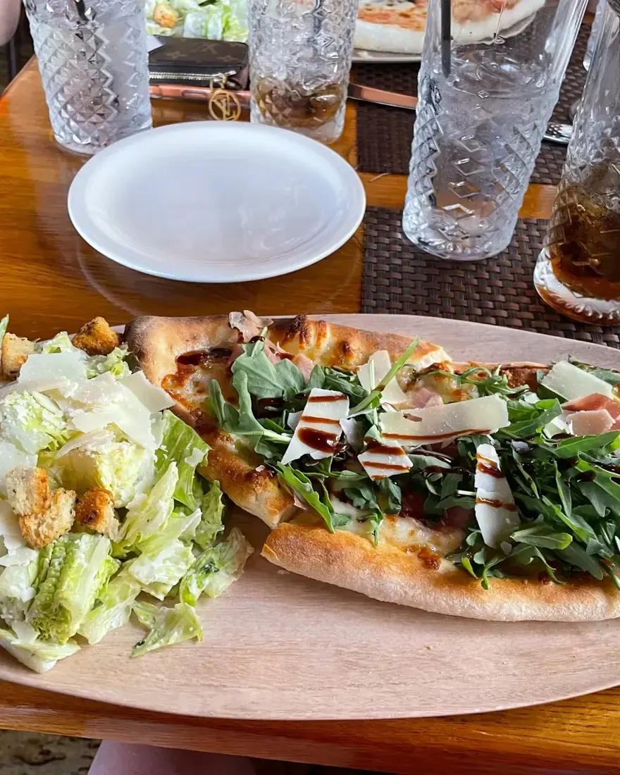 Pizza and salad on the table